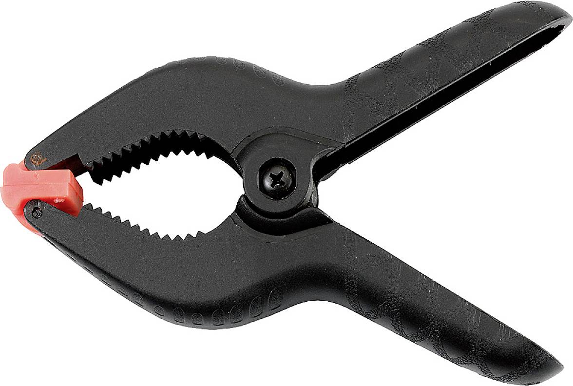 A black spring clamp with a red end piece, open, showing serrated gripping surfaces. It is used for securing objects.
