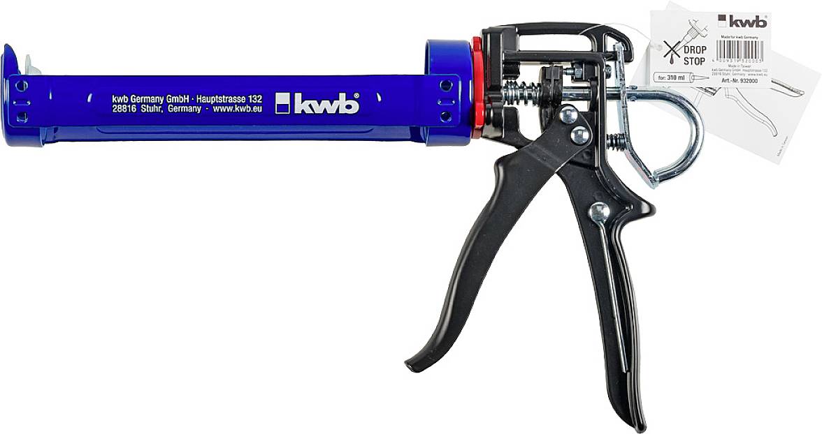 Sealant gun with a blue casing and black handle, brand 'kwb'. A user manual is visible in the background.