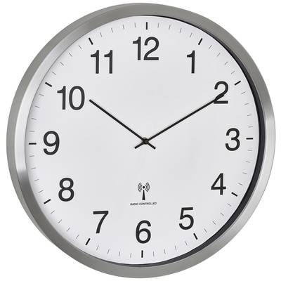A round wall clock with black hour and minute hands shows 10:10. The clockface is white with black numerals.