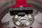 A brush cleans a car wheel rim, focusing on corrosion or dirt around the wheel hub.