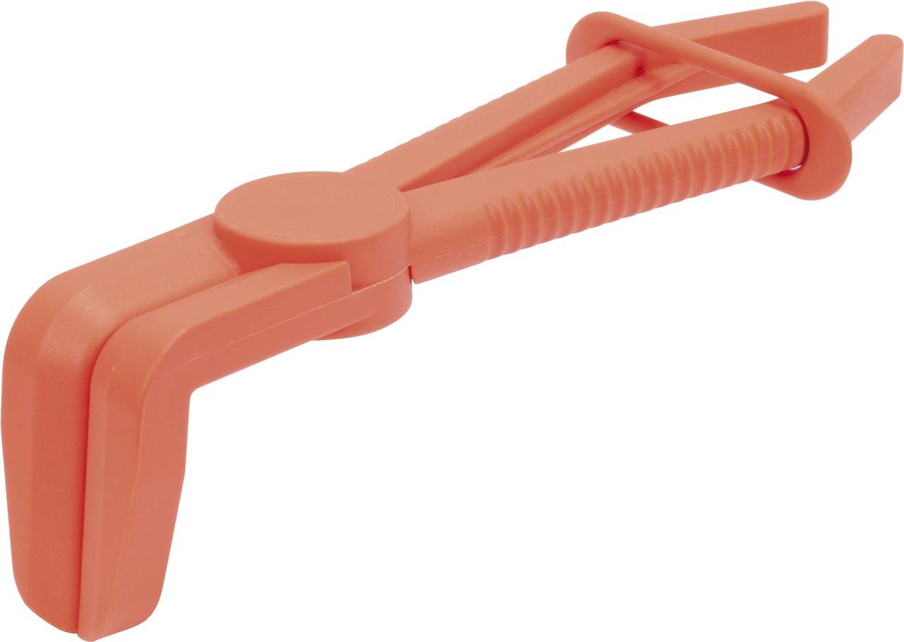 A bright orange plastic clamp used for blocking tubes in technical or medical applications.