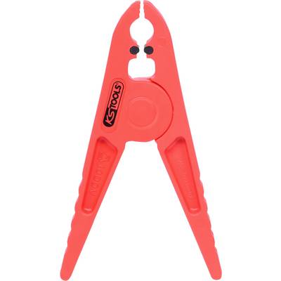 Red plastic pipe clamp made of plastic, with 'KS Tools' printed on it, used for clamping hoses during vehicle maintenance.