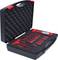 A black case with foam lining contains red tools, including spanners and a screwdriver.