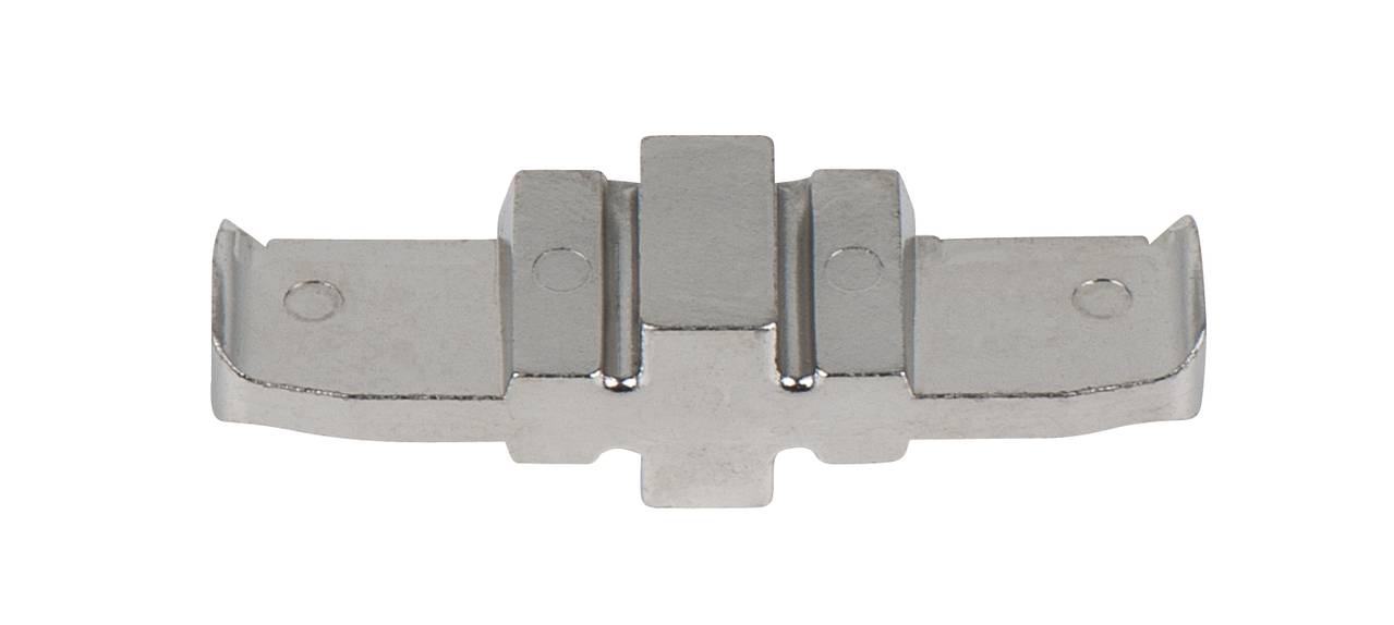 A silver, metallic car part with multiple notches and recesses, presumably for a mechanical connection.