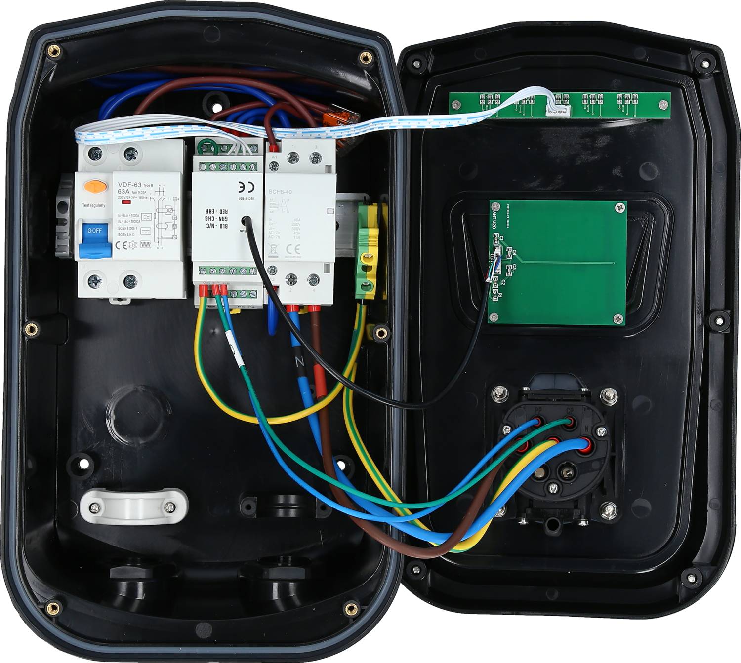 An open electrical junction box with visible cables, fuses and electronic components for power supply and control.