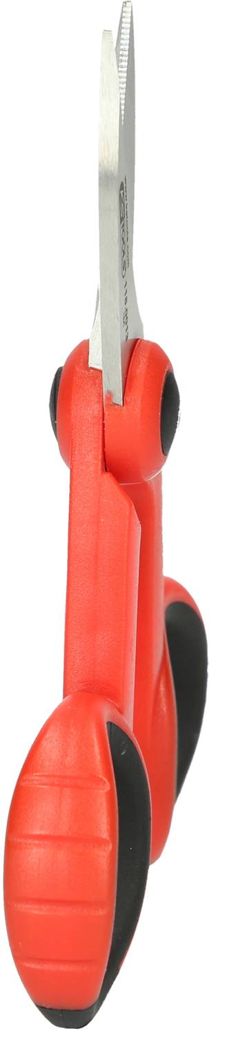 Red kitchen scissors with ergonomic handle and serrated blades, standing on the handles, suitable for versatile use.