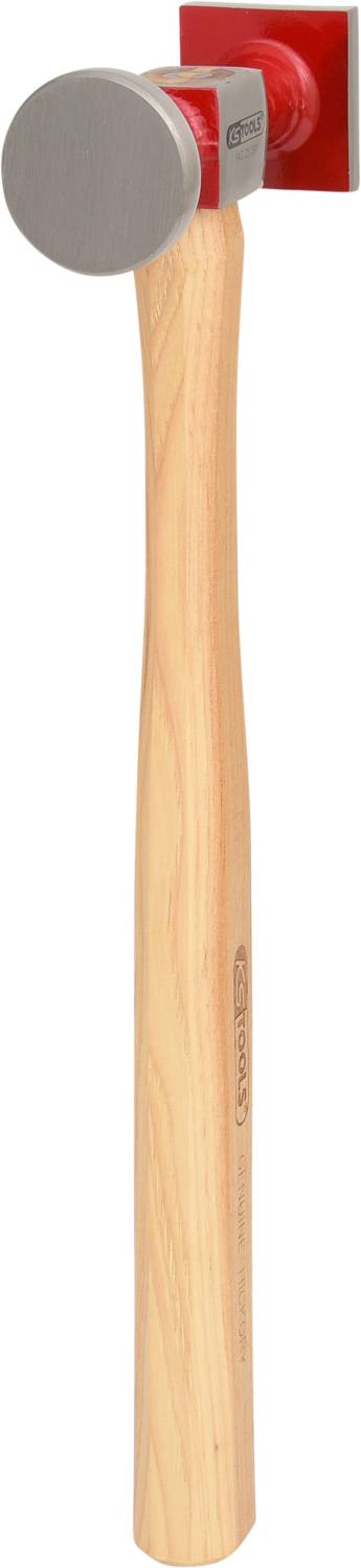 A hammer with a red metal head and a light wooden handle. The head has a flat surface for striking.