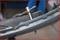 A bicycle tool is mounted in the hub of a bicycle wheel to carry out repairs or adjustments.