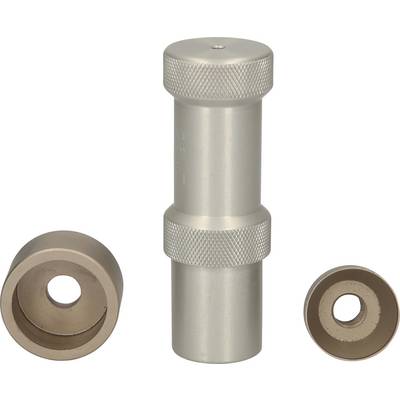 A cylindrical metal tool with a ribbed handle, flanked by two metal rings of different sizes.