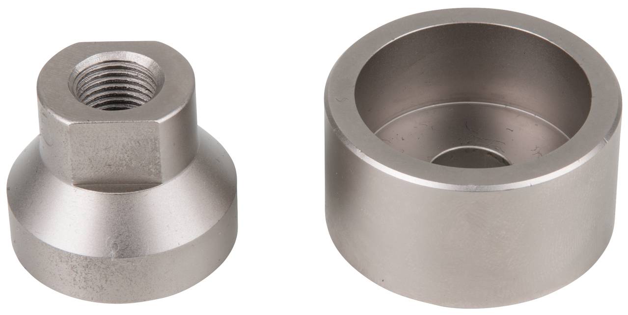 Two metal components: on the left a cylindrical part with threading; on the right a round, hollow part. Both are made of shiny metal.