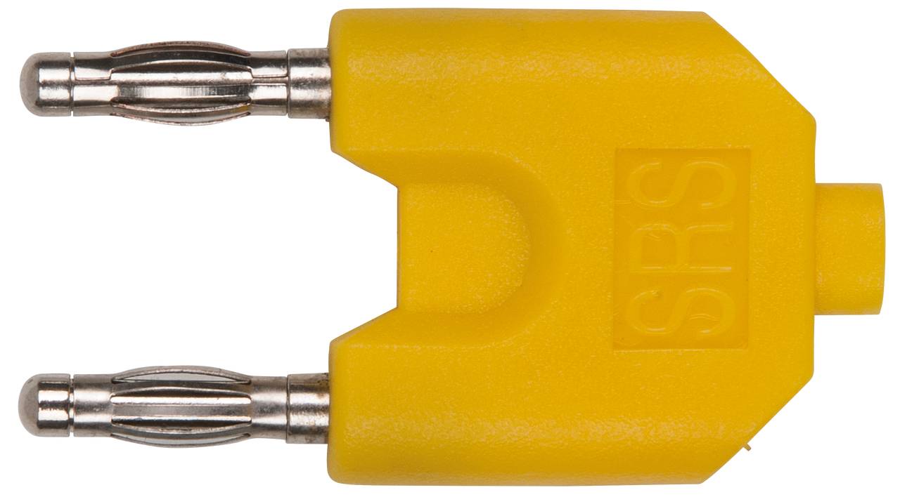 A yellow multimeter adapter with two metal plugs.