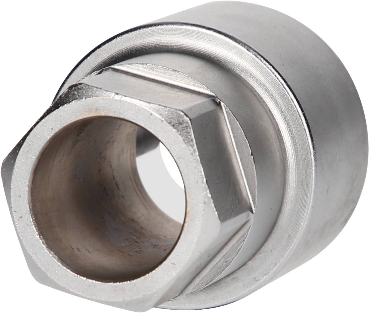 A metallic, cylindrical component with a hexagonal external surface, most likely a nut, set against a white background.