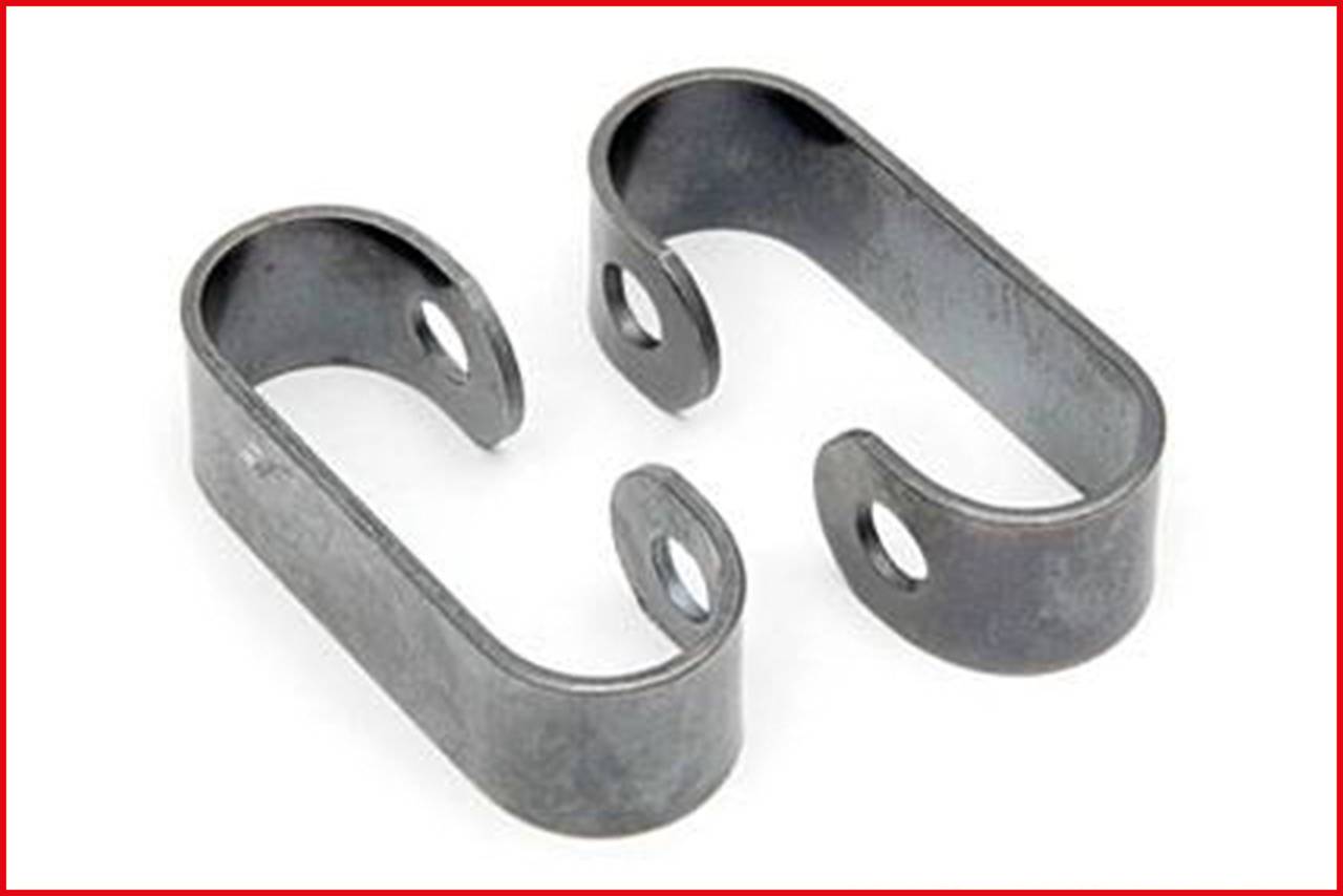 Two grey U-shaped metal clips with two holes each, on a white background.