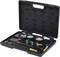 An open black toolbox containing a pressure gauge set, including two manometers, hoses, and connectors.