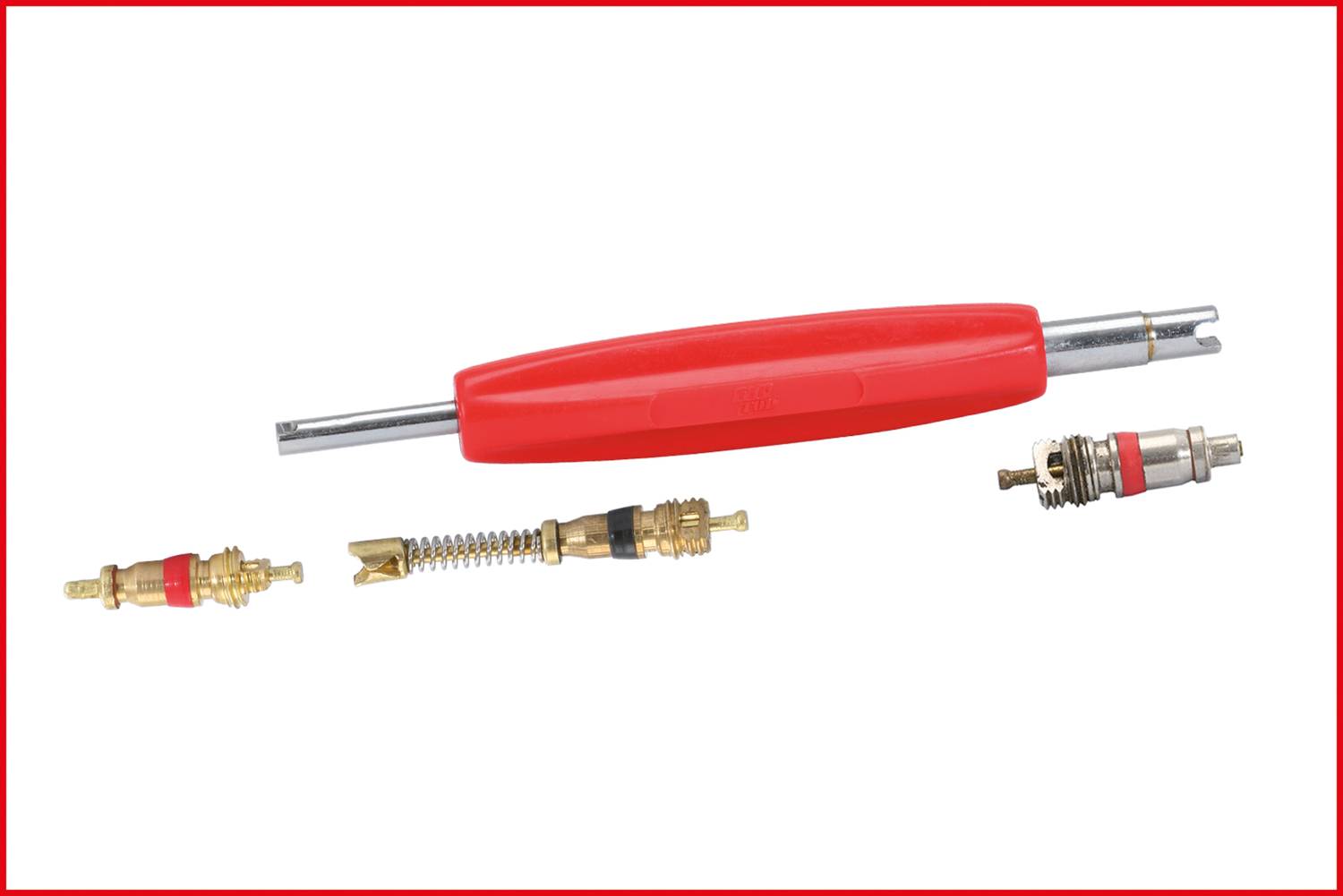 A red tool for installing or removing valve inserts, with several loose valve inserts beside it on a white background.