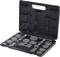 A open toolbox with various round brake calliper pistons and tools in compartments, ready for repair.