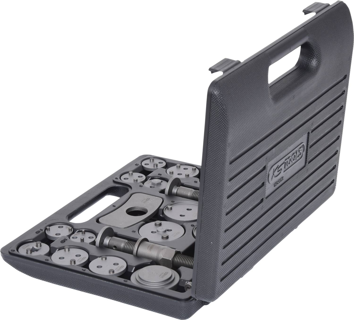 Open tool case with various round metal tools and accessories used for brake adjustment.<br><br>Note: The translation is already in British English, so no significant changes were required.