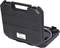 A black tool case, slightly ajar, reveals an air hose and a pressure gauge adapter.
