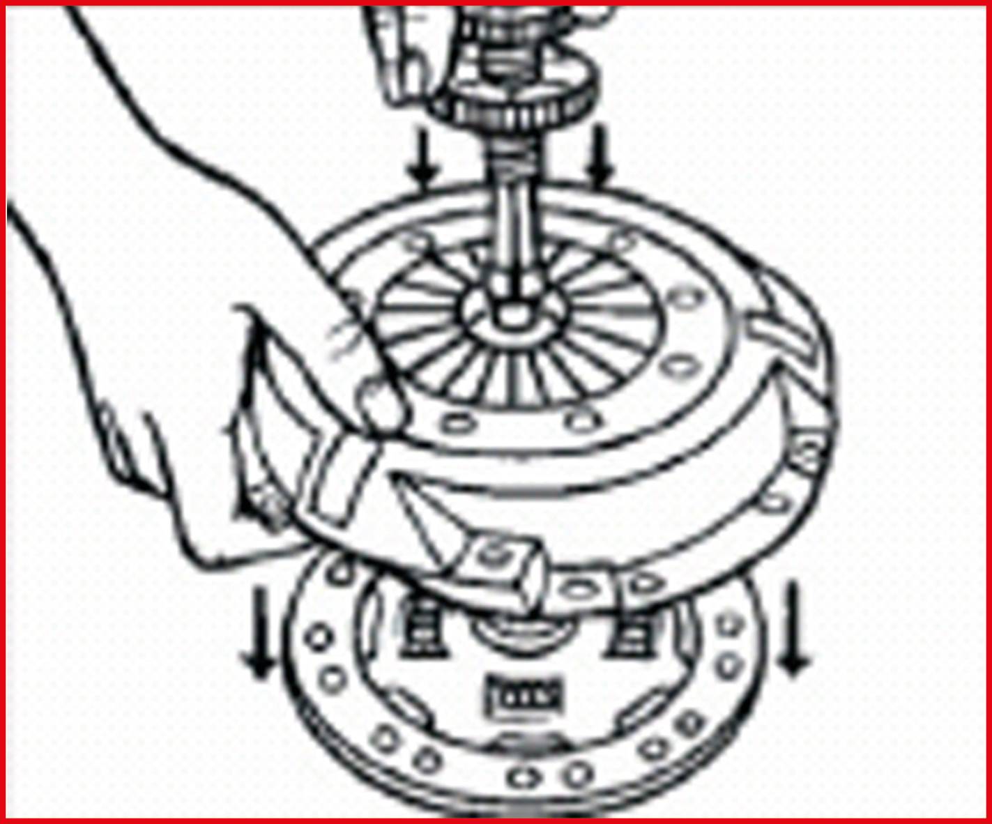 A mechanic's hand is holding a pressure plate over a clutch mechanism to install it. Arrows indicate the direction of assembly.