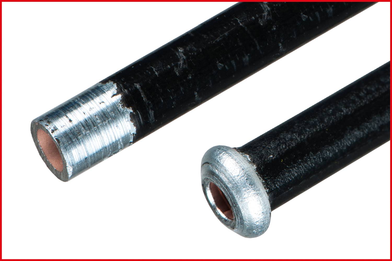 'Two black metal rods, one with an open end and the other with a rounded metal cap.'