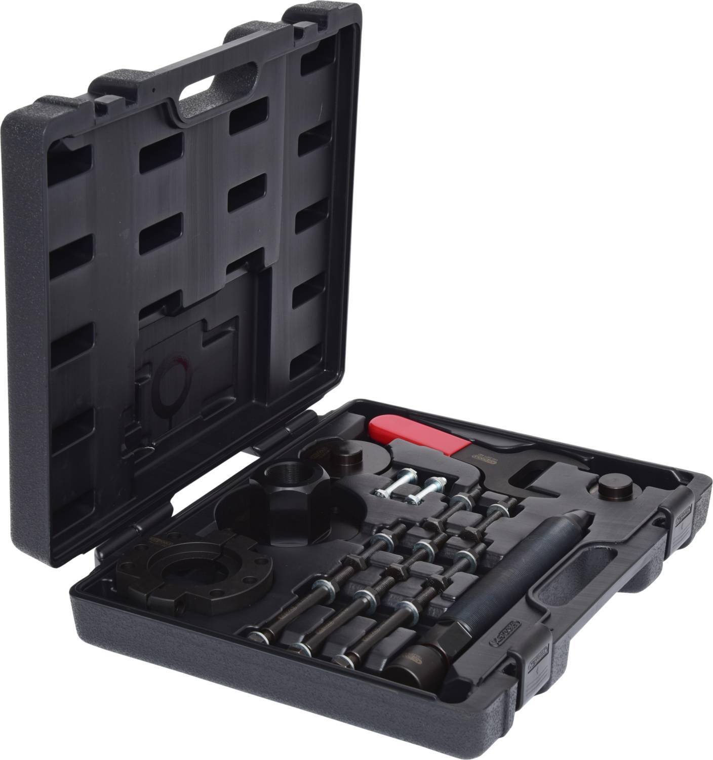 A black tool case lies open, displaying various tools, including spanners and socket attachments, neatly arranged.