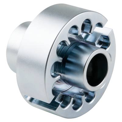 Metallic machine component, presumably a coupling, with multiple circular openings and a central cavity, demonstrating technical complexity.