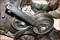 'Motor vehicle with rusted pulleys and an attached spanner used for repair or maintenance.'