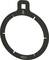 Black, circular tool with a square opening at the top and several slots. Arrow points downwards.