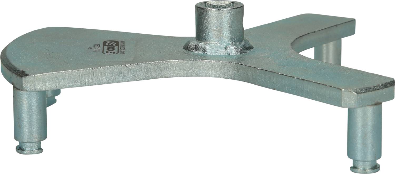 A metal tool with three legs and a central cylindrical attachment; most likely used for fixing or supporting.