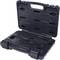 A black plastic case lies open, containing several black tools, primarily spanners of various sizes.