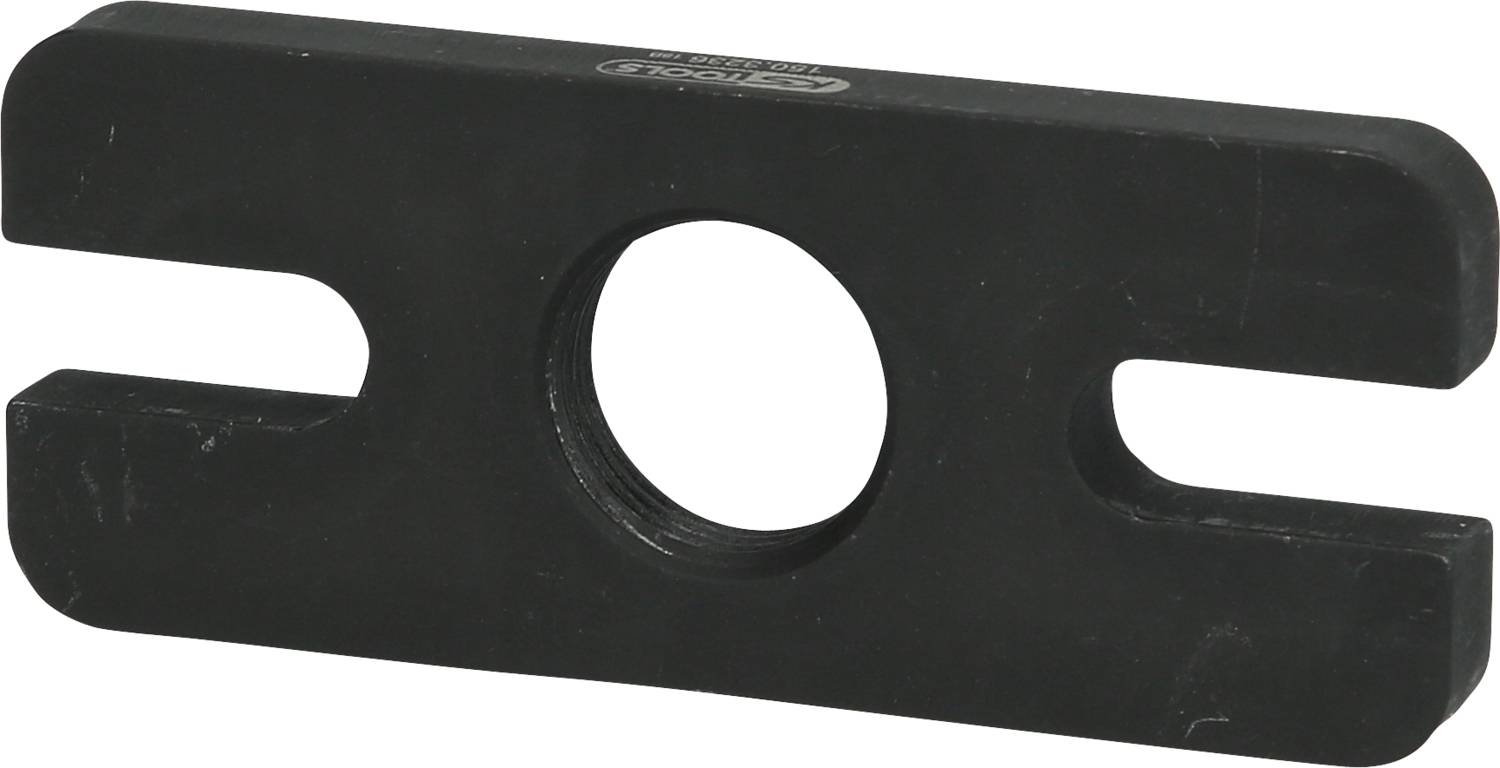 Black metal piece with a central round hole and lateral slots.