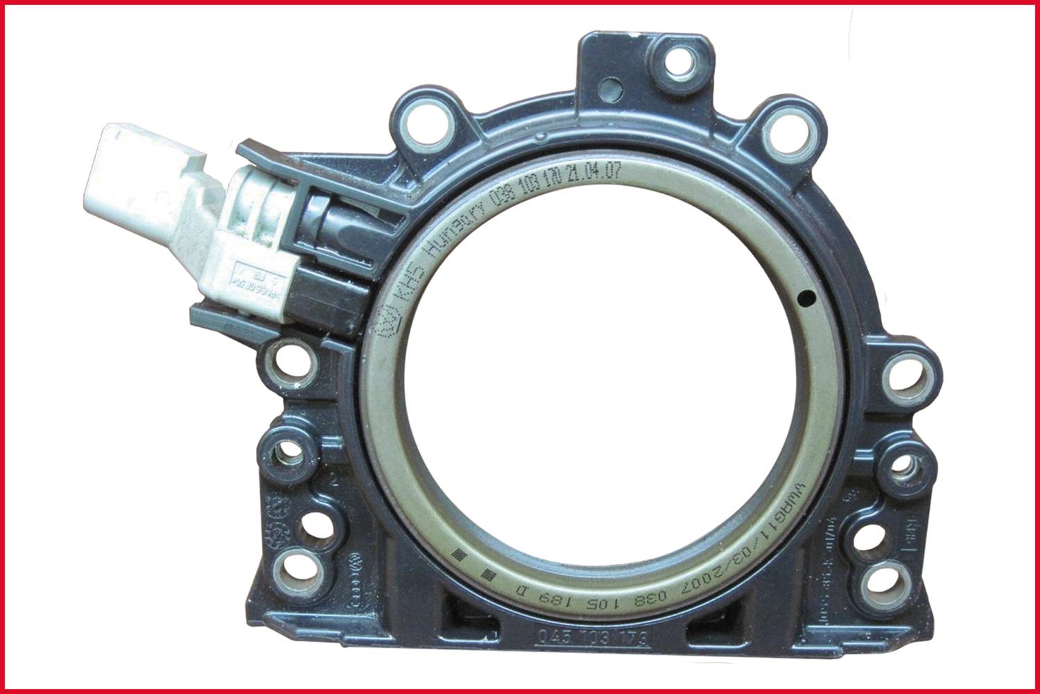 Gasket for engine with circular metal and plastic frame, critical mechanical component in automotive engines.<br><br>Correction to British English:<br><br>Gasket for engine with circular metal and plastic frame, critical mechanical component in automotive engines.