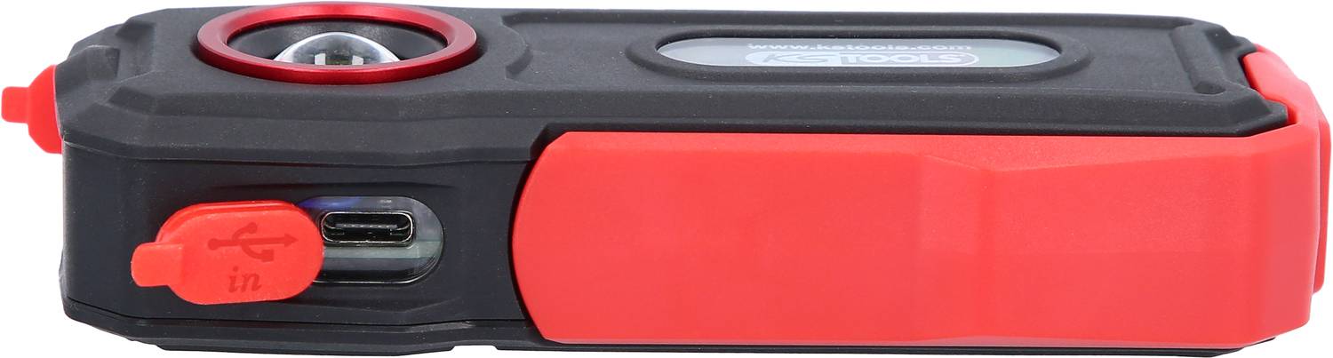 A portable, rectangular device with a black casing and red accents, featuring a USB-C port and a circular lens attachment.