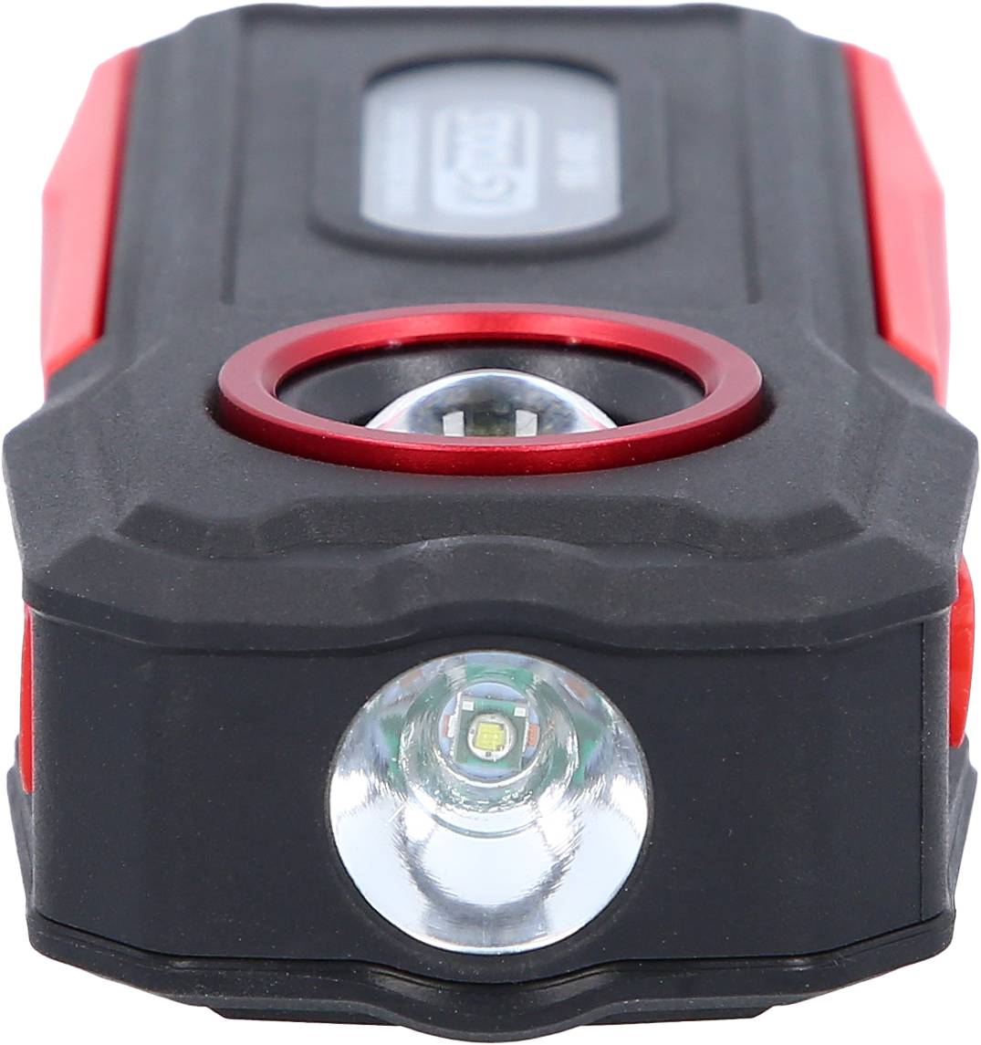 A black and red bicycle light with two LED lamps, featuring a bright front light and a smaller upper light.