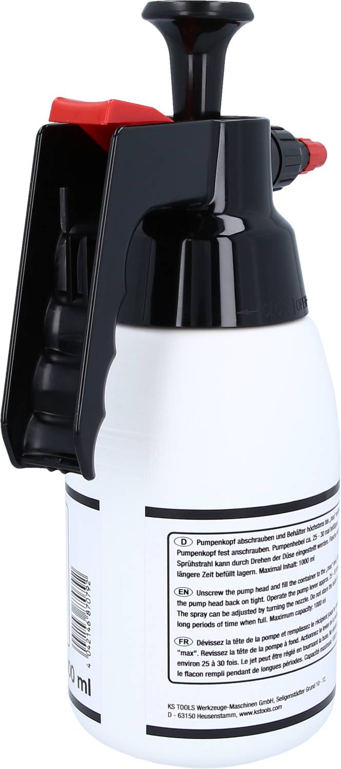 A white spray bottle with a black handle and a red button, with instructions in various languages printed on its label.