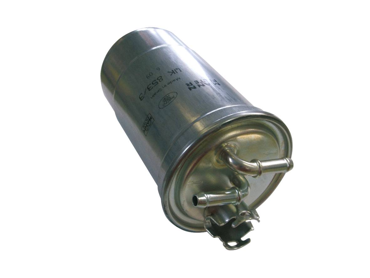 A silver car fuel filter with multiple outlets, lying on a white surface. Contains labelling with numbers and letters.