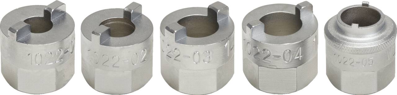 Five silver metal socket key inserts in a row. Each has a different number engraved, ranging from '1022-02' to '1022-05'.
