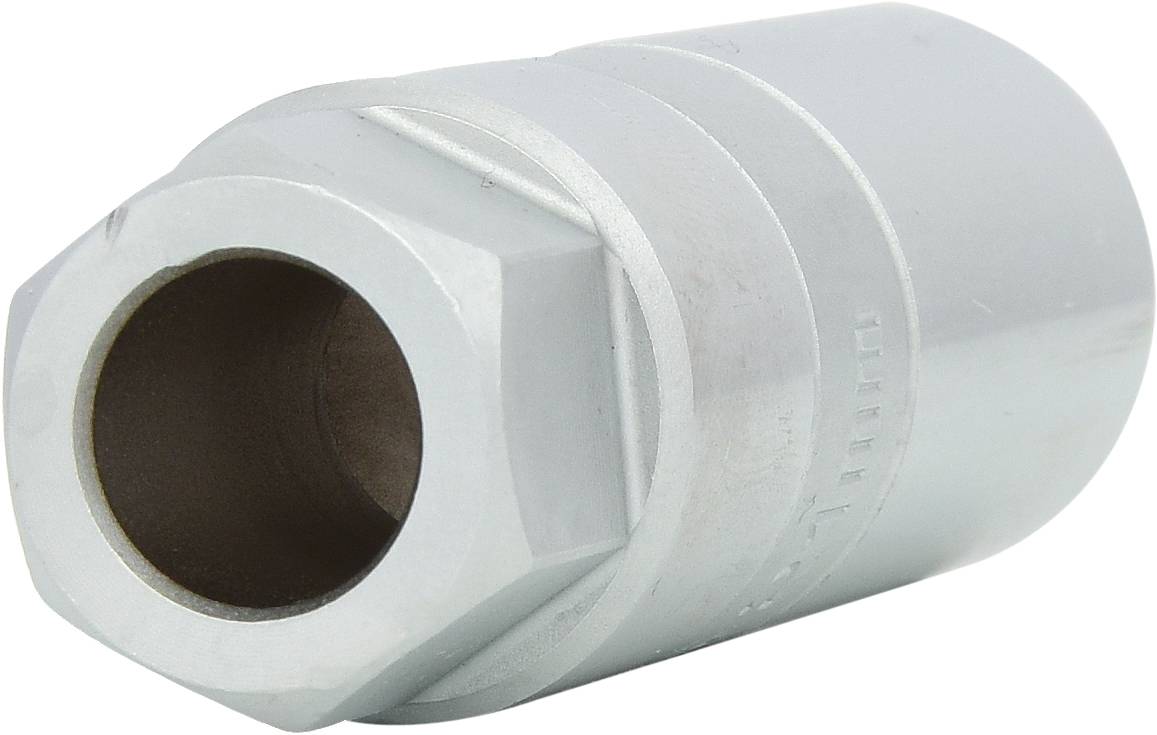 A silver socket with a hexagonal opening, used for turning nuts or bolts, is lying on a white surface.