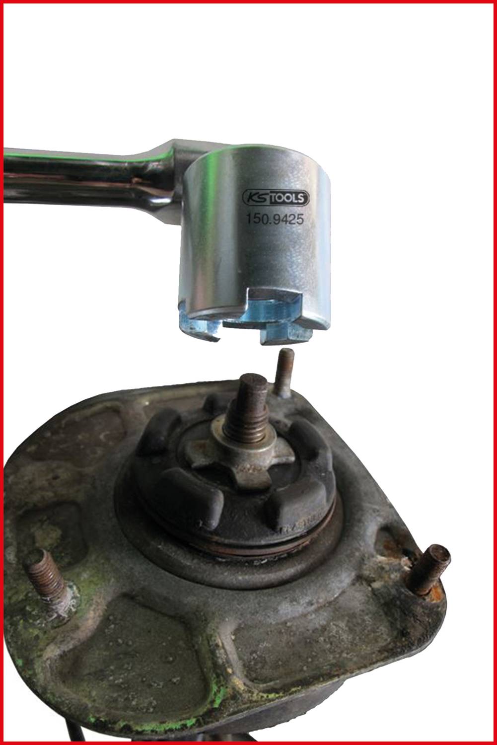 Metal key on a rusty screw of old machinery; close-up reveals tool during maintenance work.