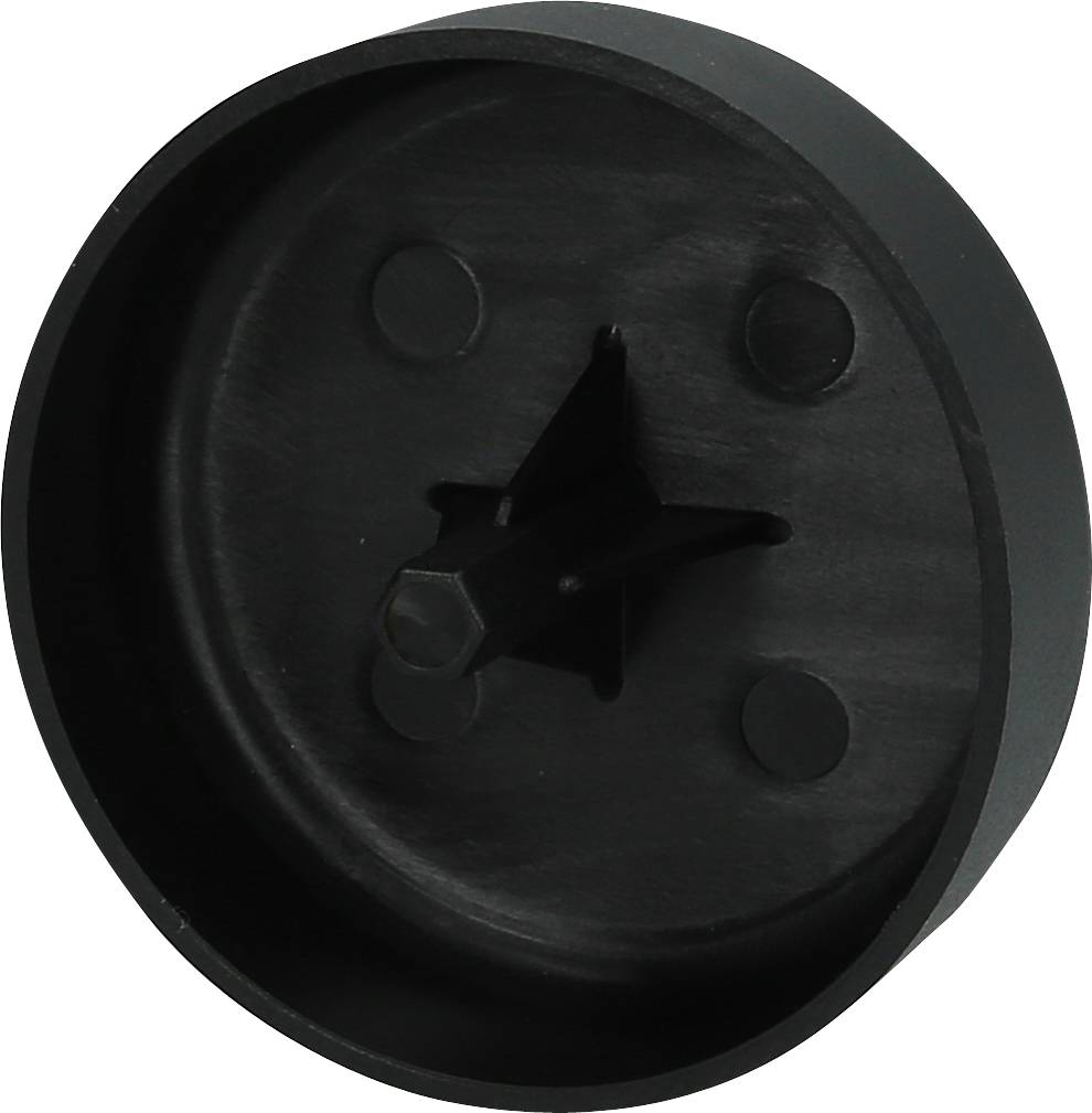 A black, round plastic object with a star-shaped protrusion in the centre and three smaller round protrusions.
