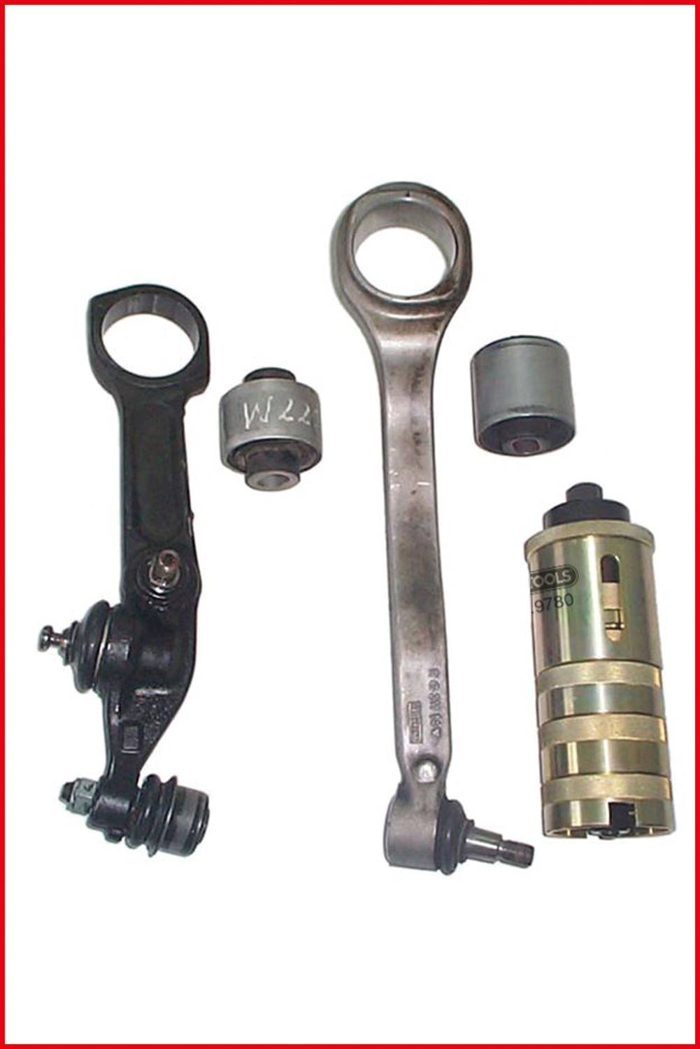 A black-metallic and silver-gleaming vehicle suspension with mechanical components; parts distinctly visible.