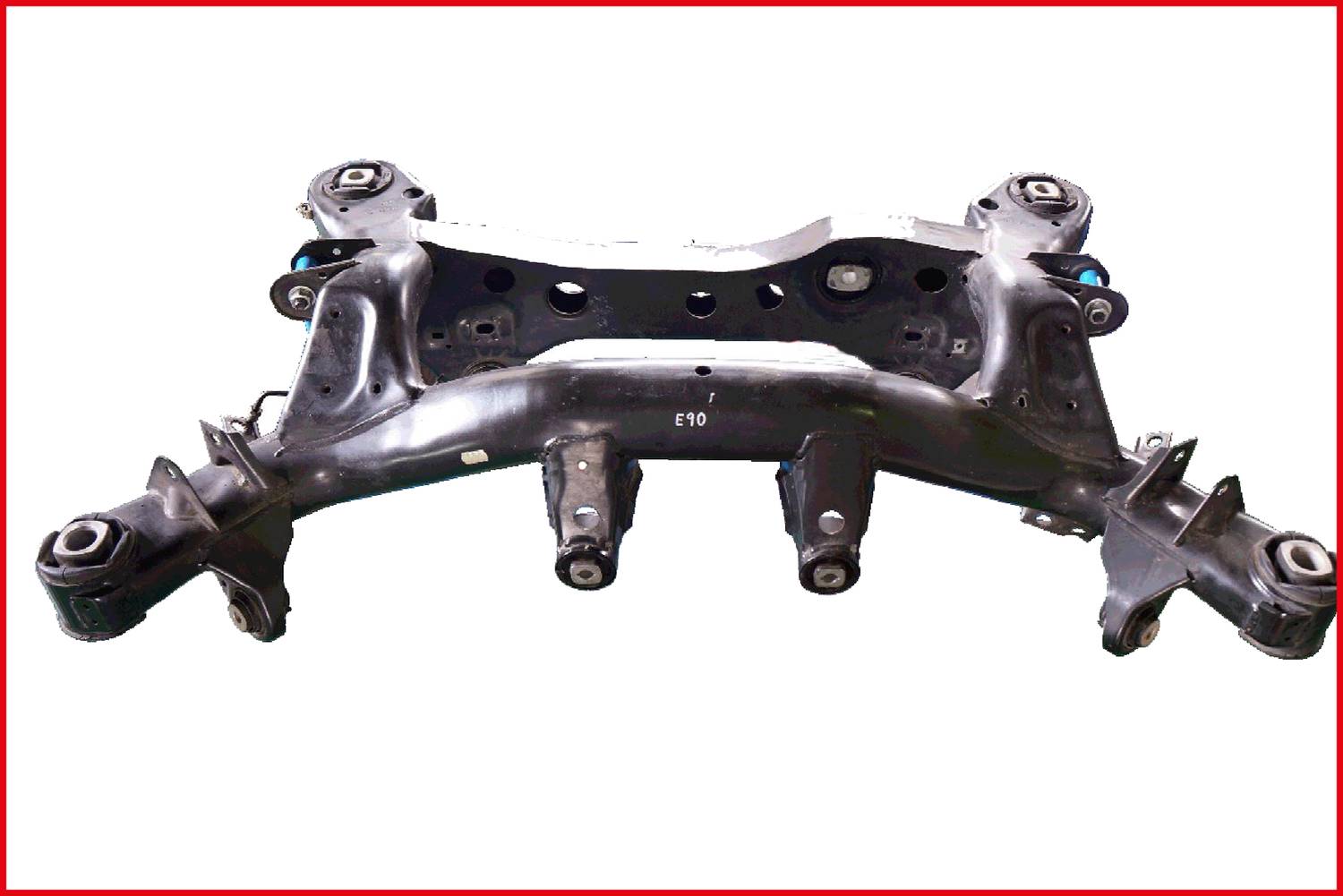 A black metal frame with multiple struts and mounting points, likely part of a vehicle. Neutral background.