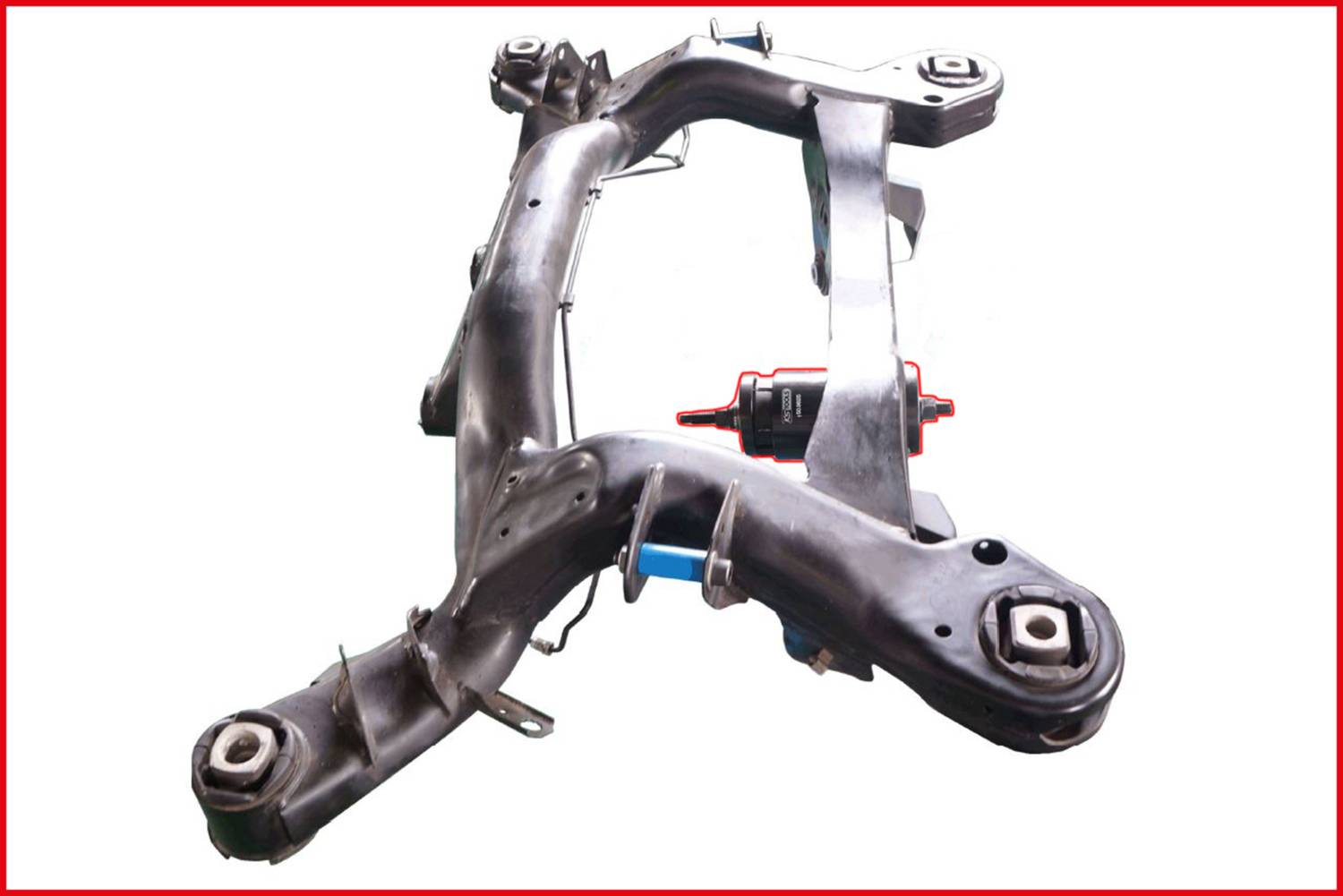 A metal frame with a curved structure, likely part of a vehicle suspension, on a white background.