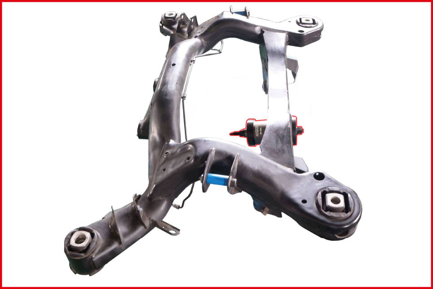 'Metal structure of an automotive part, likely a vehicle axle or suspension component, with multiple connection points.'