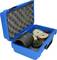 A blue tool case with foam inserts, filled with round metal weights and a black cylinder. Case open.