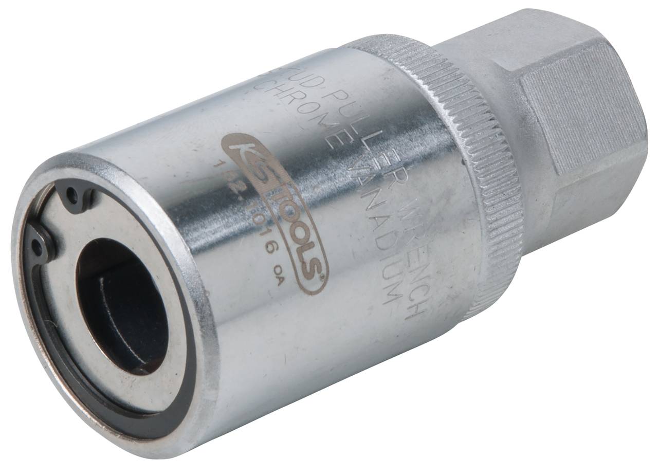 A silver metal camshaft puller, cylindrical in shape, with internal mechanisms for attachment to engines during dismantling.