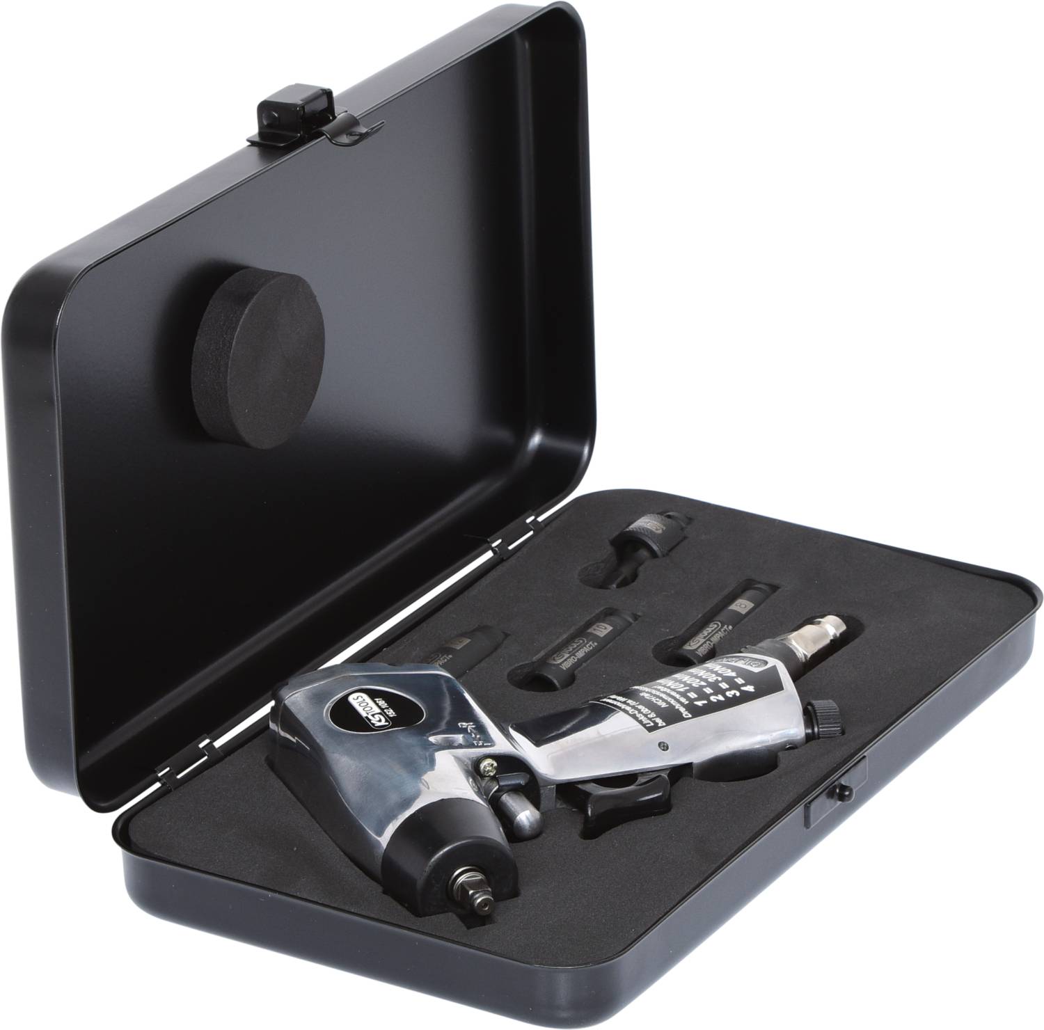 An open black suitcase with an electrical device and accessory parts inside, lying on black foam.