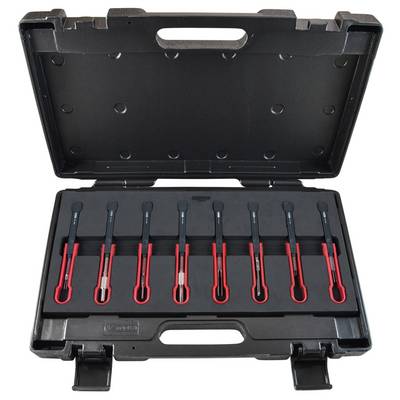 Black plastic case with seven red spark plug connectors in an orderly row, suitable for workshop needs or car repairs.