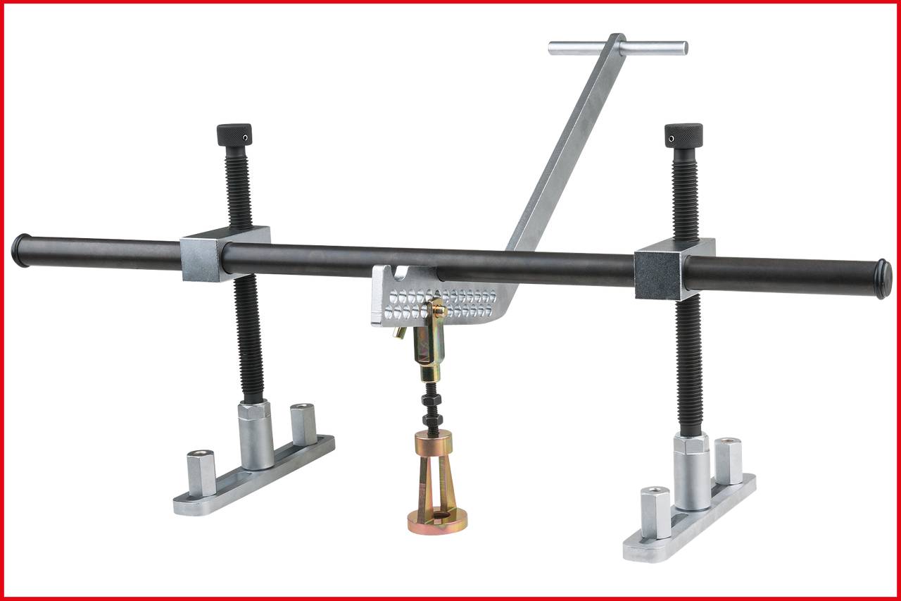 'A bearing puller tool with an adjustable screw and two fixed standing feet, designed to remove bearings from shafts.'