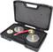 A black suitcase with an open lid reveals various measuring and testing instruments with golden connectors and a red hose.